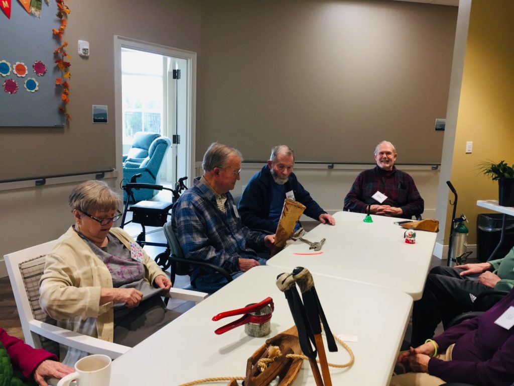 Seniors sitting around a long table